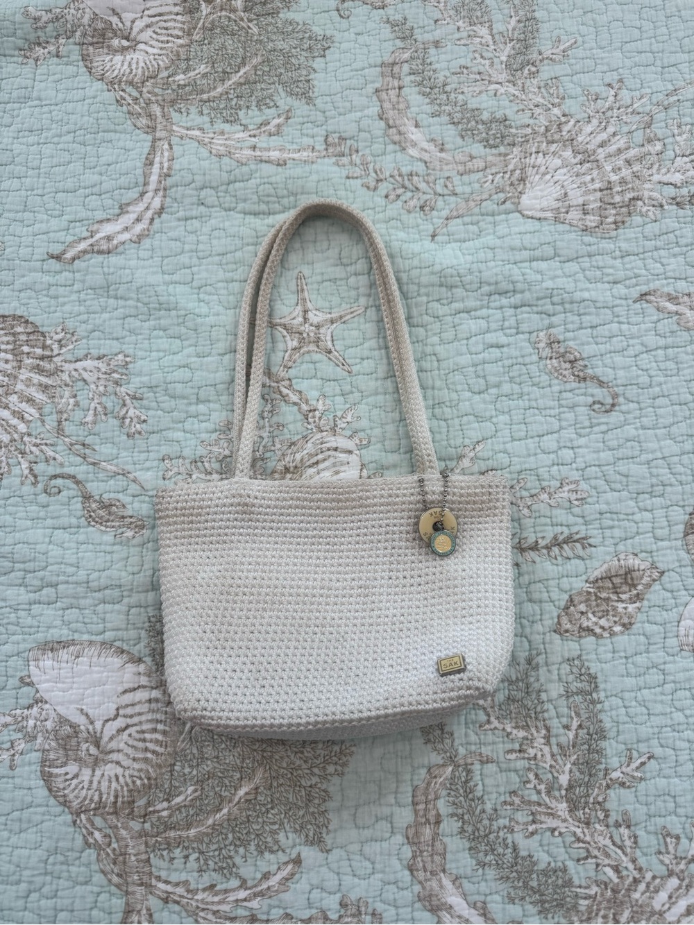 The Sak Cream Crochet Shoulder Bag with Baby Yellow Accents